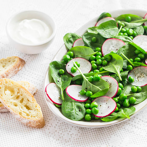 istock Green peas, radish and baby spinach salad 514101218