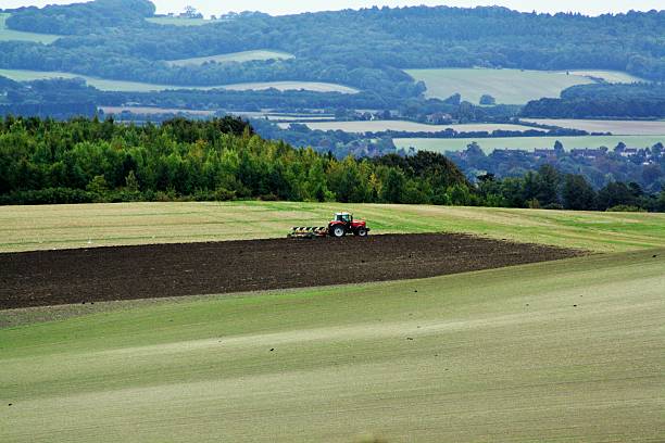 istock Tractor Ploughing a field in England 514101364