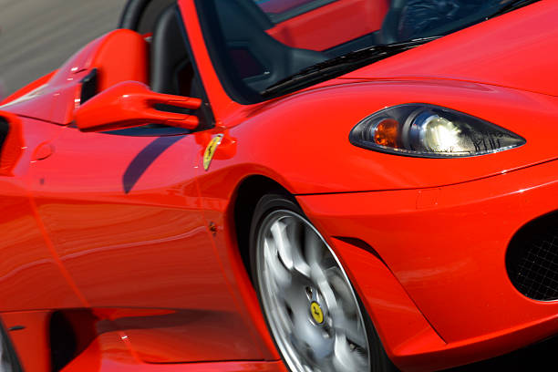 Ferrari F430 Spider Zandvoort, The Netherlands - June 29, 2014: Detail on a red Ferrari F430 Spider convertible sports car driving on the Zandvoort race track during the 2014 Italia a Zandvoort day. ferrari ferrari f430 italian culture action stock pictures, royalty-free photos & images