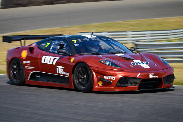 Ferrari F430 FXX race car at the race track Zandvoort, The Netherlands - June 29, 2014: Ferrari F430 FXX race car driving on the Zandvoort race track during the 2014 Italia a Zandvoort day. ferrari ferrari f430 italian culture action stock pictures, royalty-free photos & images