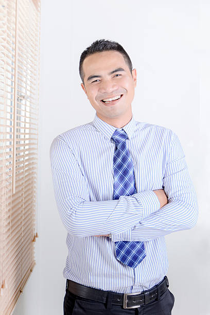 istock Smile asian business man standing 514104856