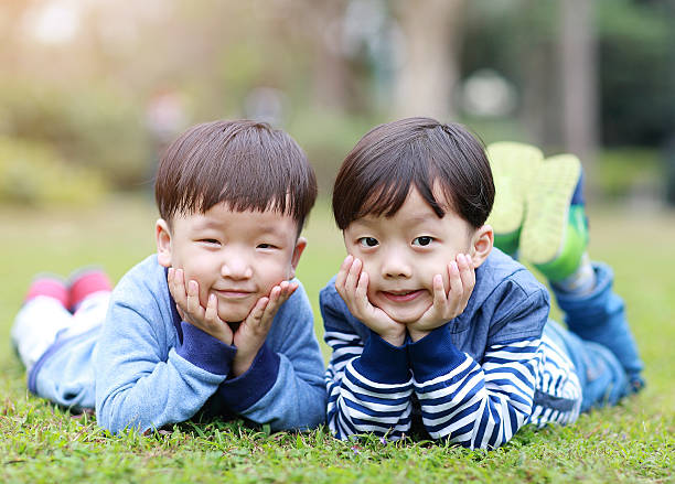 istock Two brothers play in the park 514105080