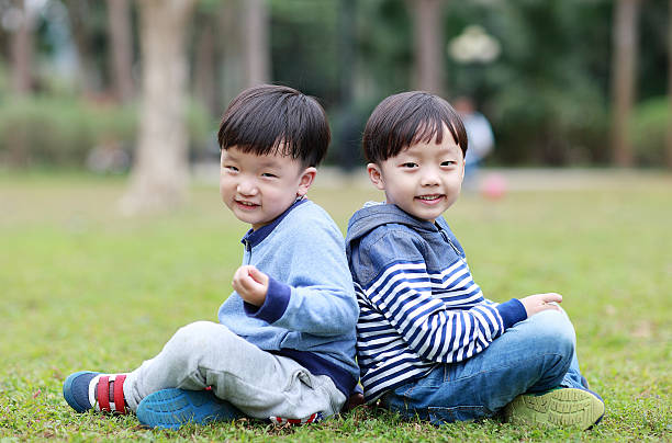 istock Two brothers play in the park 514105592