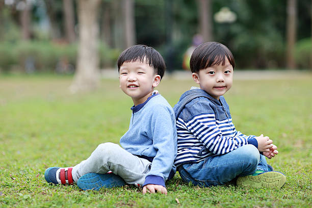 istock Two brothers play in the park 514105786