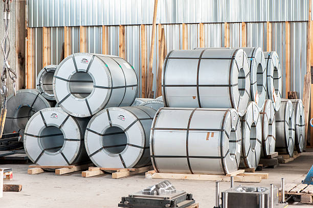 istock Bended steel/metal sheet rolls in factory warehouse/workshop. 514107019