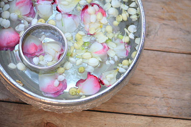 istock Water in bowl mixed with perfume and flowers 514107968