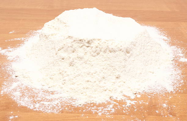 istock Heap of wheat flour on table 514108553