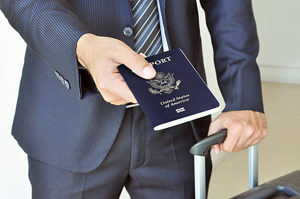 istock Businessman giving U.S. passport 514108575
