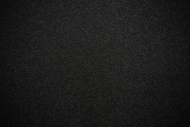 Black sandpaper texture background stock photo