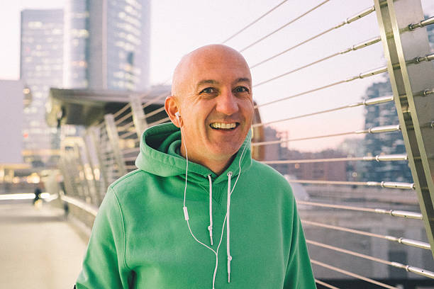 istock Cheerful Mature Man Running Outdoors Wearing Sport Clothes 514111224