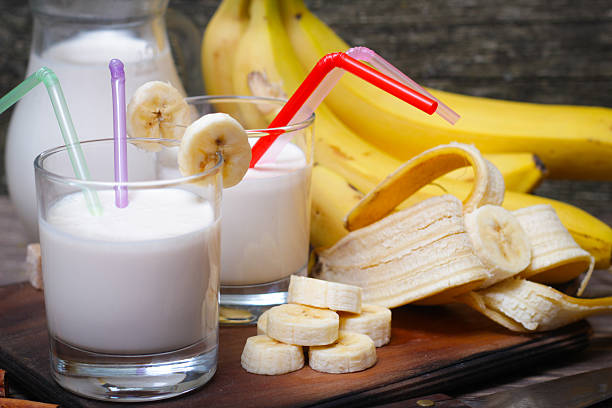 istock Fresh made Banana smoothie on wooden background 514111308