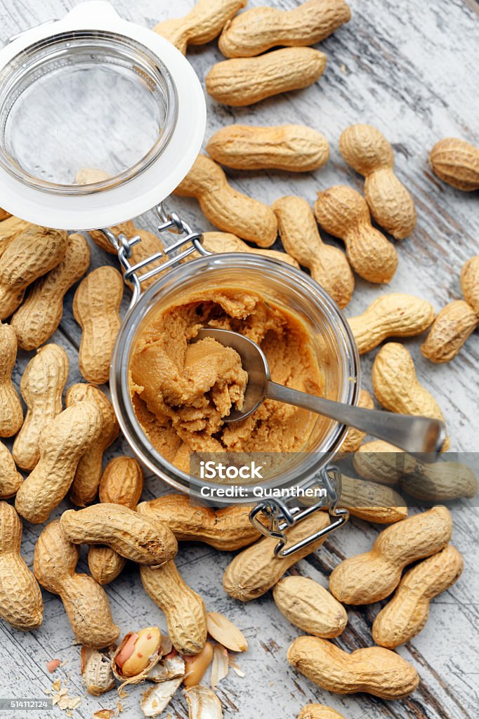 Homemade peanuts butter Homemade peanuts butter in a glass jar view from above Eating Stock Photo