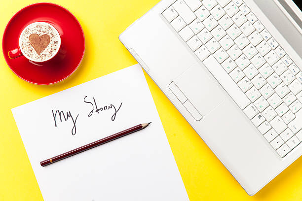 istock paper, pencil, laptop and cup lying on the table 514115100