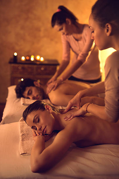 istock Relaxed couple enjoying during back massage at the spa. 514117642