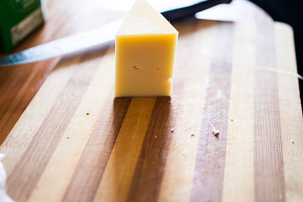 istock Piece of cheese on a table 514120078