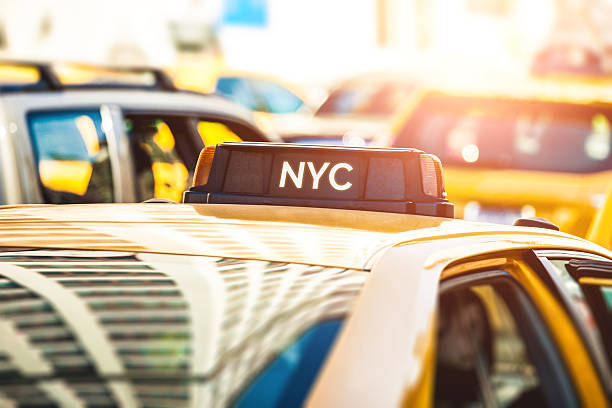 Close up of a typical New York taxi Close up of a typical New York yellow taxi. new york state license plate stock pictures, royalty-free photos & images