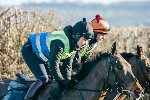 Jockeys ride out early on a winter's morning. Anthony Honeyball Racing, Potwell Farm Stables, Mosterton, Dorset