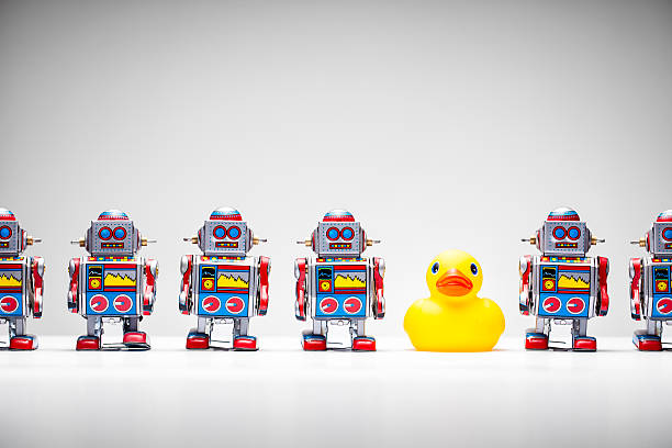 istock Standing out from the crowd - Tin Robot Rubber Duck 514133685