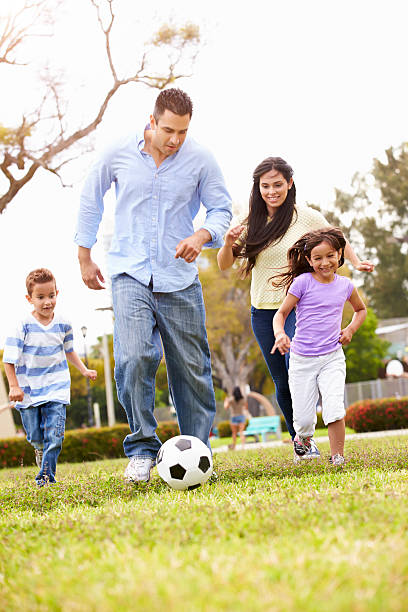 istock Hispanic Family Playing Soccer Together 514134067