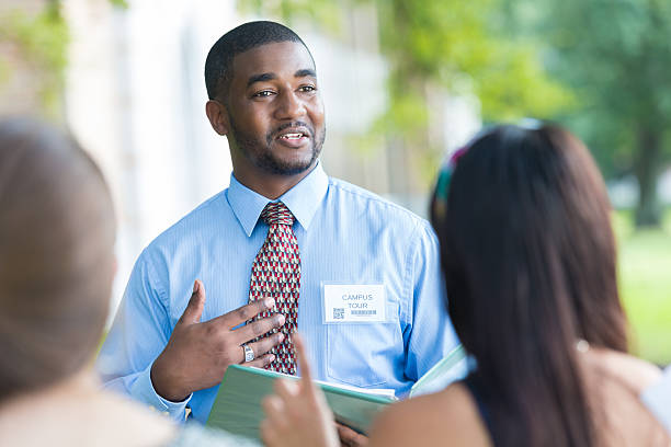istock Tour guide director talking during college campus visit 514134303