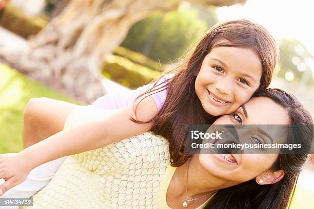 Portrait Of Hispanic Mother And Daughter In Park Stock Photo - Download Image Now - Latin American and Hispanic Ethnicity, Mother, Child