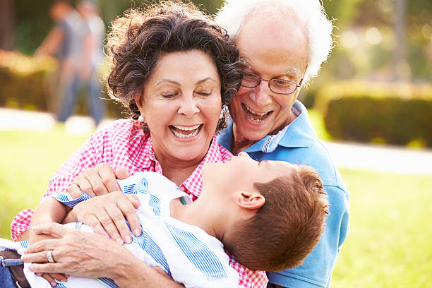 istock Grandparents Having Fun In Park With Grandson 514134751