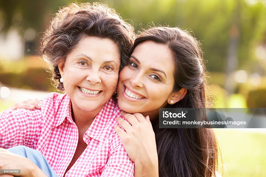Mother With Adult Daughter In Park Together Mother With Adult Daughter In Park Together Smiling To Camera Mother Stock Photo