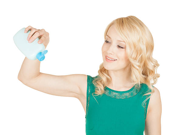 istock Beautiful blonde holds in a hand a bottle cosmetics 514137287