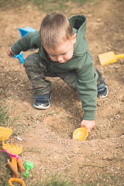 istock Toddler Playing In the Dirt 514138589