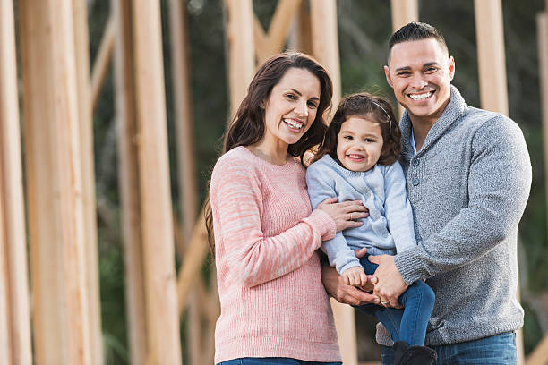 istock Hispanic family building a new home 514152898