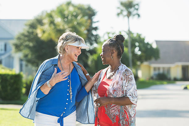 Senior women taking a walk on a sunny day, talking