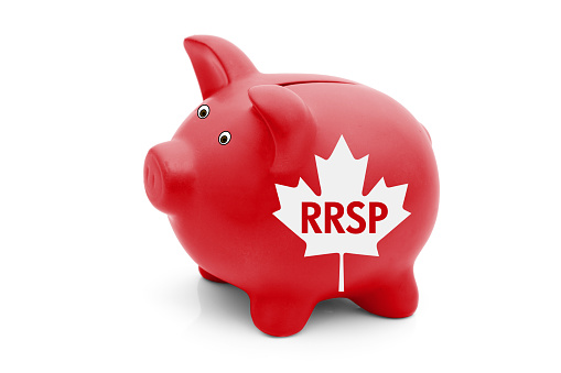 Registered Retirement Savings Plan in Canada, A red piggy bank with a white Canadian maple leaf flag and text RRSP isolated on white