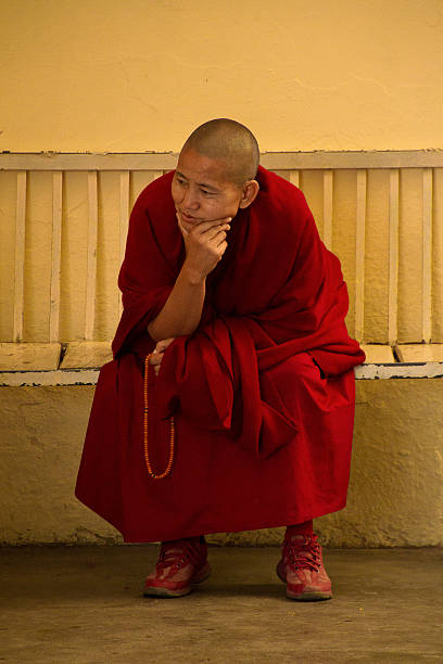 McLeod Ganj, India - February 18, 2016: Buddhist nun celebrates Losar, the Tibetan New Year at the Dalai Lama temple, McLeod Ganj, India
