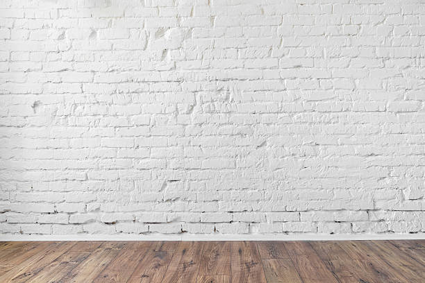 istock white brick wall background texture wooden floor 514154910