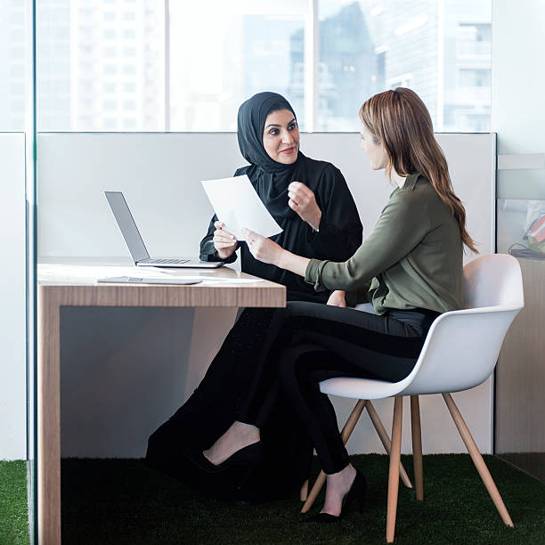 istock Two businesswomen in office cubicle, Dubai, UAE 514155414