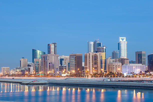 Manama skyline at night, Bahrain Skyline of Manama city illuminated at night. Kingdom of Bahrain, Middle East manama stock pictures, royalty-free photos & images