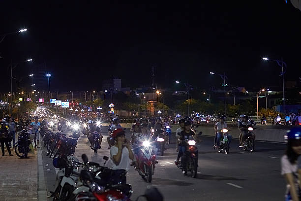 istock Evening  in Danang, Vietnam. Motorbikes on road. 514160490