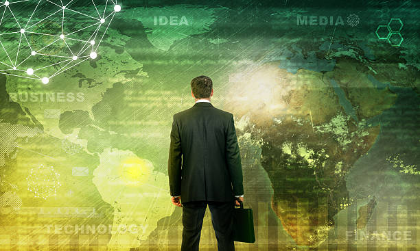istock Businessman in front of world map 514161042