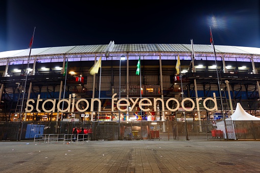 Rotterdam, the Netherlands - March 3, 2016: Exterior of Stadion Feijenoord, home ground of the Dutch professional football club Feyenoord Rotterdam, during the night of the semi final KNVB cup. The match is in progress, outside are only a few people left to check tickets.