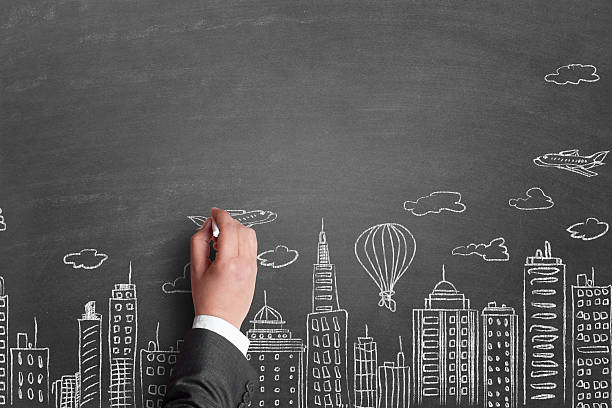 istock Businessman drawing airplane over cityscape 514162718