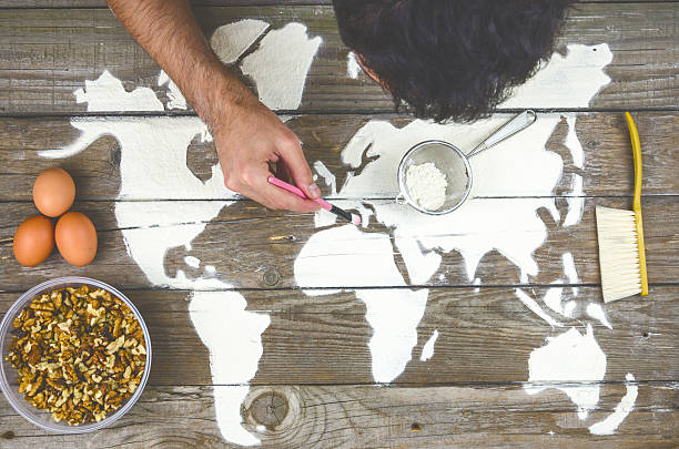 istock Drawing maps of the world with flour 514165192