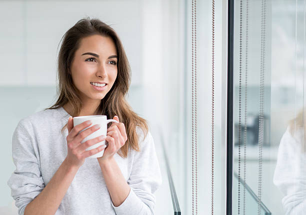 istock Casual woman at home drinking coffee 514165350