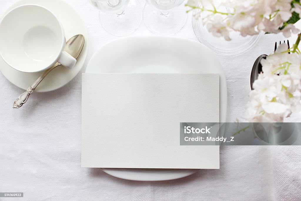 Table card mockup, menu mockup. Wedding fashion photography Table card mockup, menu mockup. Wedding fashion photography. Wedding invitation. Place card, reserved card. White beautiful dishware. Trendy white colors stylish photo. Wedding Stock Photo