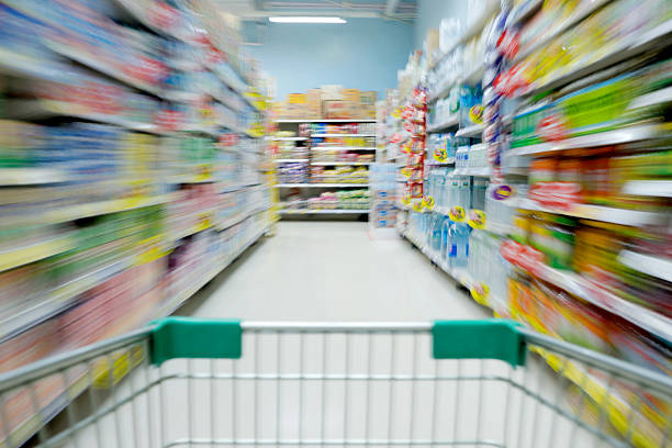 Shopping in supermarket shopping cart view with motion blur Shopping in supermarket shopping cart view with motion blur blurred motion street car green stock pictures, royalty-free photos & images