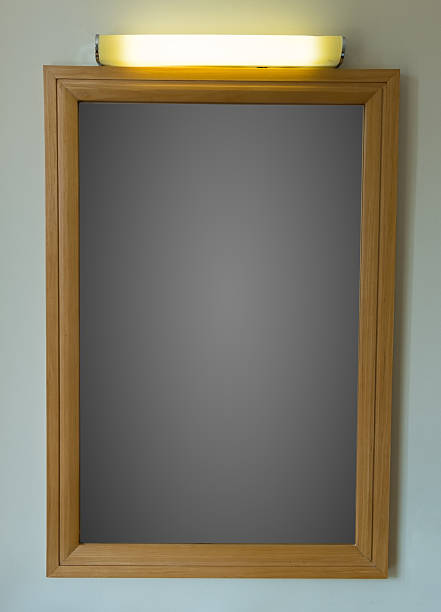 istock Board wooden frame and lamp on top hang on the wall 514167504