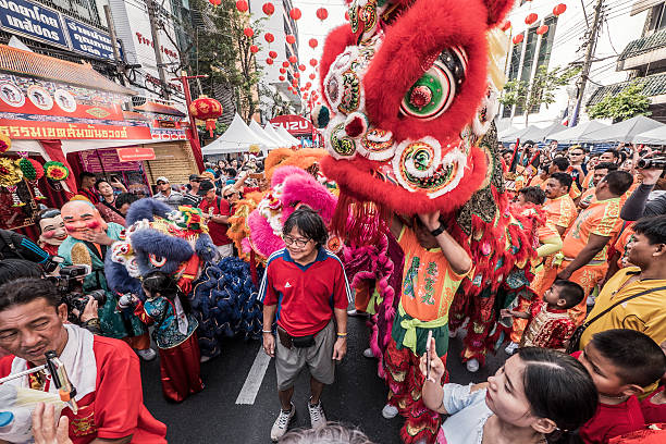 Bangkok, Thailand - February 8, 2016: Lion dance among crowd at Yaowarat Road during the celebration of the Chinese New Year in Chinatown Bangkok Thailand