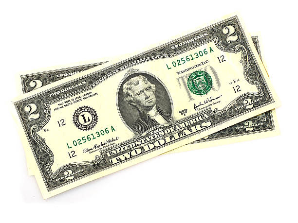 istock Close up of two dollar bill isolate on white background. 514169242