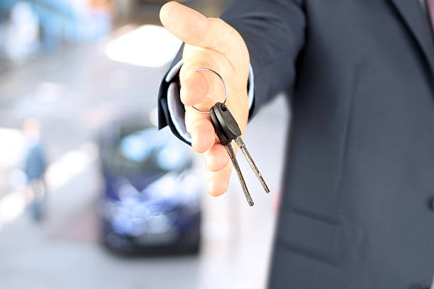 istock Real-estate agent giving  a house  key. 514171694