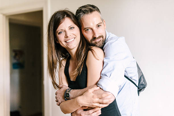 istock Happy couple embracing and laughing 514171886