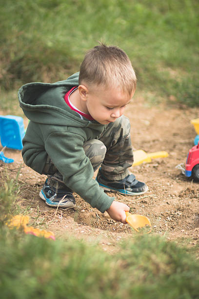 istock Toddler Playing In the Dirt 514174477